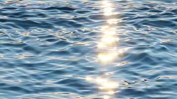 Sunlight shining through the water on a calm surface photo