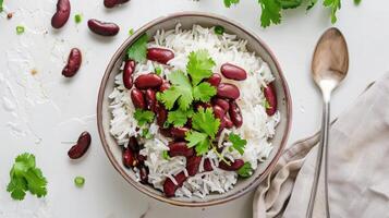 Indian red beans and rice in a bowl with cilantro and parsley photo