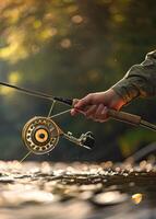 A person holding a fishing rod and reel in the water photo