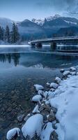 A bridge over a river with snow on the ground photo