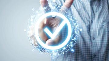 A man is holding up a check mark with a glowing circle photo