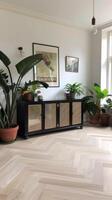A living room with a wooden floor and plants photo