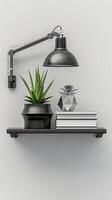 A black shelf with a lamp and books on it photo