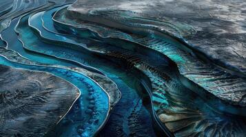 A blue river flowing through a mountain range photo