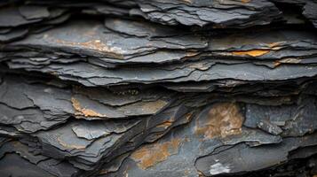 A close up of a rock wall with some orange paint photo