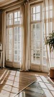 A room with a large window and a rug photo