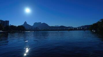 A large body of water with a mountain in the background photo