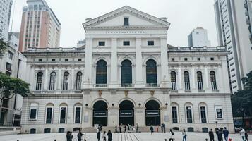 The building is white and has many windows photo