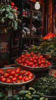 A man is standing in front of a market with a bunch of vegetables photo