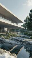 A modern house with a pond and rocks photo