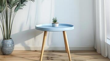 A small blue table with a plant on it photo