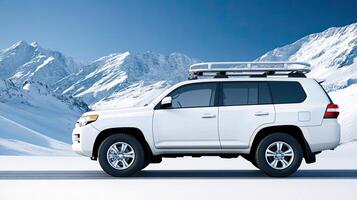 A white suv driving through the mountains photo