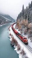 A train traveling down a snowy river in the winter photo