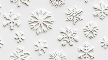 A group of white snowflakes arranged on a white surface photo