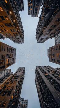 A view of tall buildings with lights in the sky photo