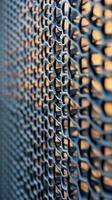 A close up of a metal mesh wall photo