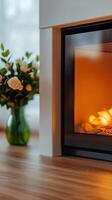 A fireplace with flames and flowers in it photo