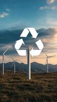 Wind turbines in the background with a recycling symbol photo