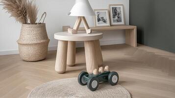 A wooden toy car sits on a wooden table photo
