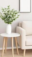 A white couch and table with a vase of flowers photo