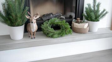 Christmas wreaths and deer on a fireplace mantel photo