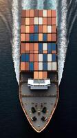 A cargo ship is traveling through the ocean photo
