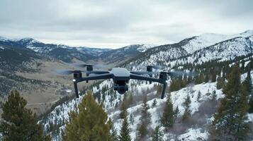 A drone flying over a snowy mountain range photo