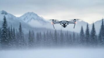 A drone flying over a snowy mountain range photo