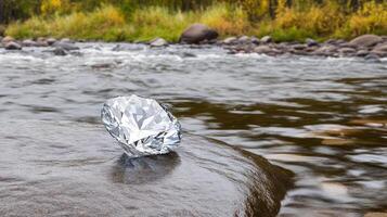 A diamond is sitting on a rock in a river photo