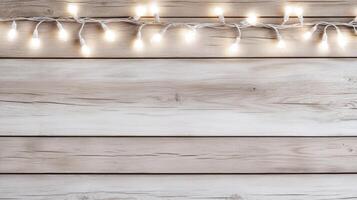 Christmas lights on wooden wall background photo