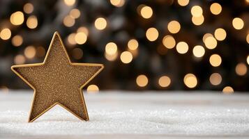 A golden star on a snowy background with blurred lights photo