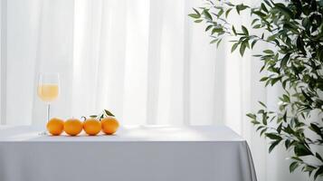 A table with two glasses of champagne and oranges photo