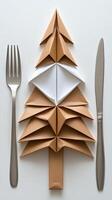 A fork and knife are made out of folded paper photo