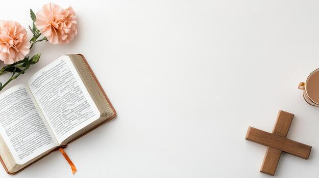 An open bible, a cup of coffee and a cross on a white background photo