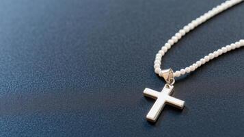 A cross pendant on a silver chain photo