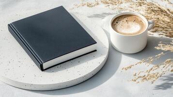 Coffee and book on white table photo