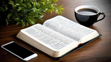 An open bible, coffee and smartphone on a wooden table photo