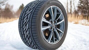A tire on a snowy road in the winter photo
