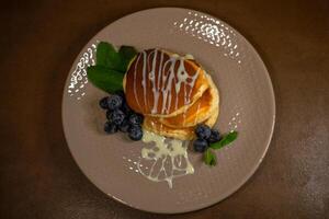 Blueberry and condensed milk pancakes are the best solution for breakfast photo