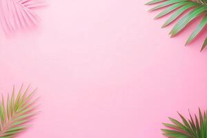 Tropical leaves on a pink background for design purposes. photo