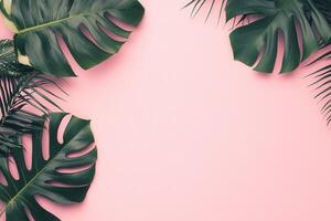 Tropical leaves on a pink background for design purposes. photo