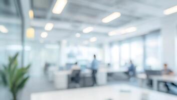 Blurred office space with people working at desks photo