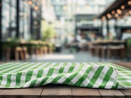 Tablecloth on wooden table with blurred background photo