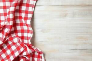 Checkered tablecloth on wooden table photo