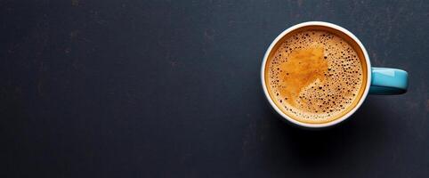 Top view of a cup of coffee on a dark background photo