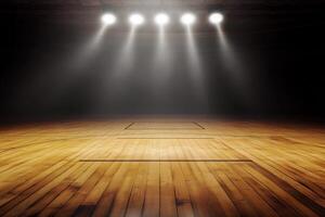 An empty basketball court with lights shining down photo