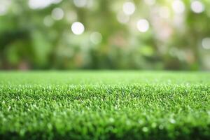 Artificial grass background with bokeh effect photo