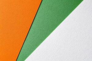 Three different colors of paper with an orange, green and white stripe photo