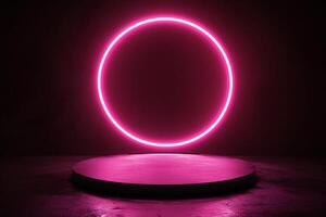 A pink neon circle on a black surface photo