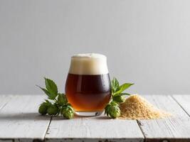 Craft beer with hops and malt on a rustic wooden table. photo